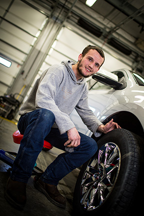 Lifeworks Associate Wyatt Kihlstrom puts the finishing touches on a vehicle during his shift at Chuck Spaeth Ford.